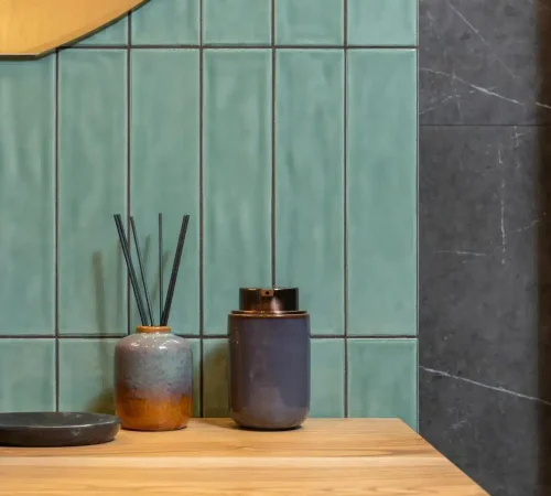 Reed diffuser and aroma diffuser on a wooden counter
